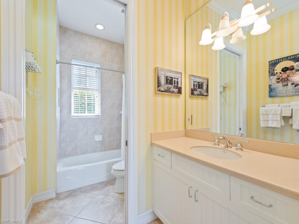 505 Harbour Drive Naples, FL 34103 - Photo 16 of 37 a bathroom with a sink a toilet and a bathtub