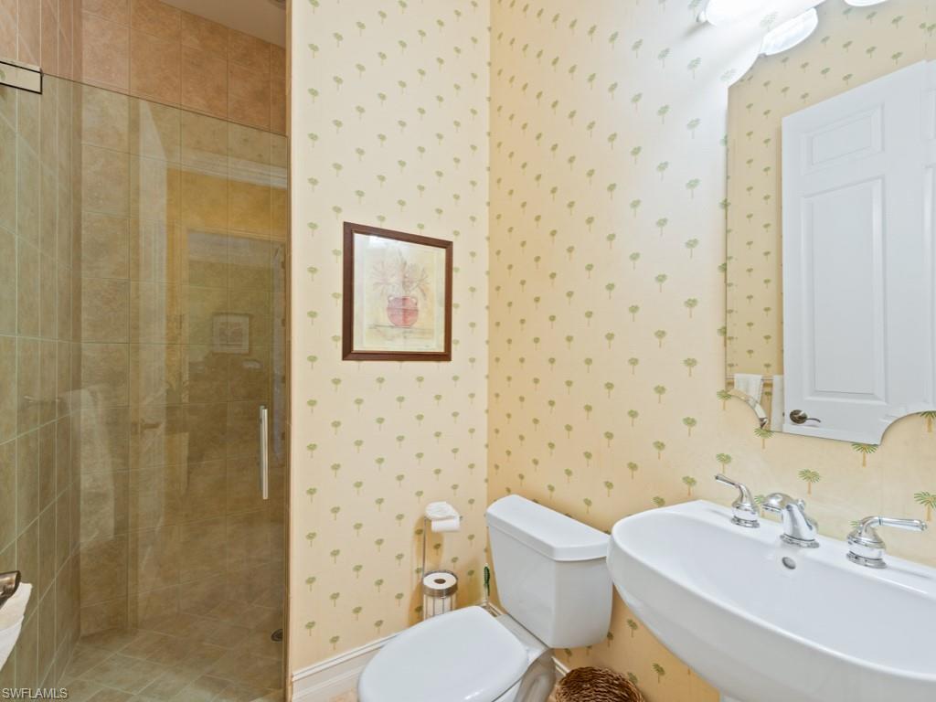 505 Harbour Drive Naples, FL 34103 - Photo 18 of 37 a bathroom with a sink toilet and shower