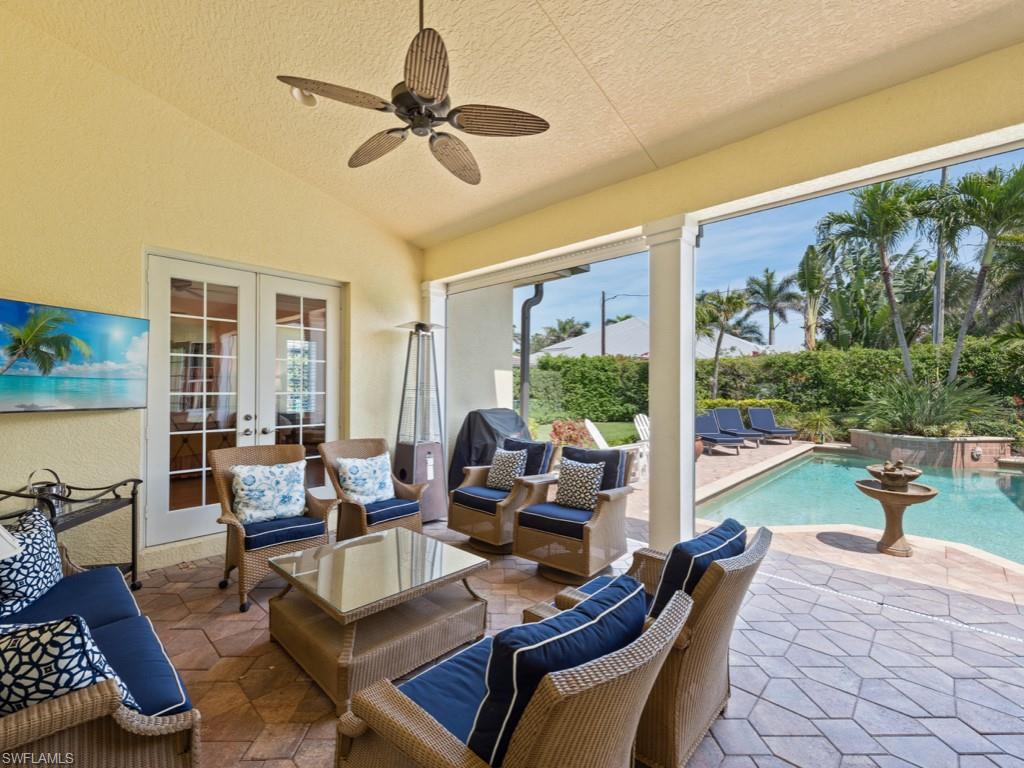 505 Harbour Drive Naples, FL 34103 - Photo 22 of 37 a living room with furniture and a large window