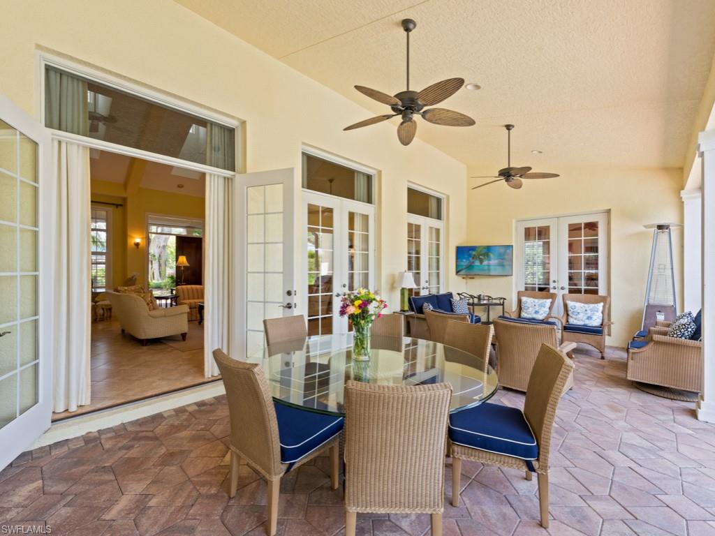505 Harbour Drive Naples, FL 34103 - Photo 23 of 37 a view of a dining room with furniture and a chandelier