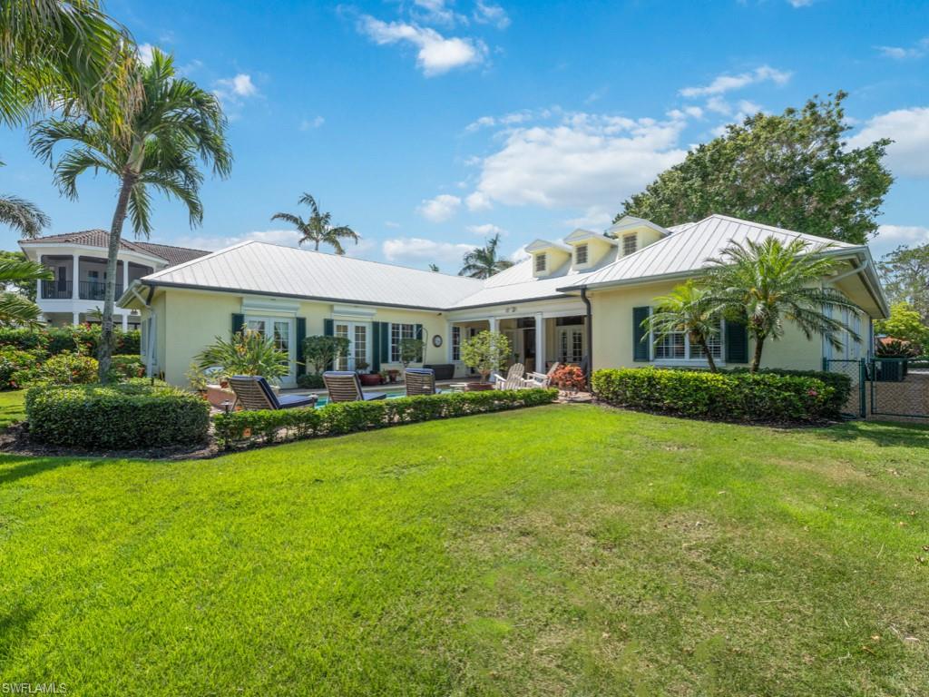505 Harbour Drive Naples, FL 34103 - Photo 31 of 37 a front view of a house with garden