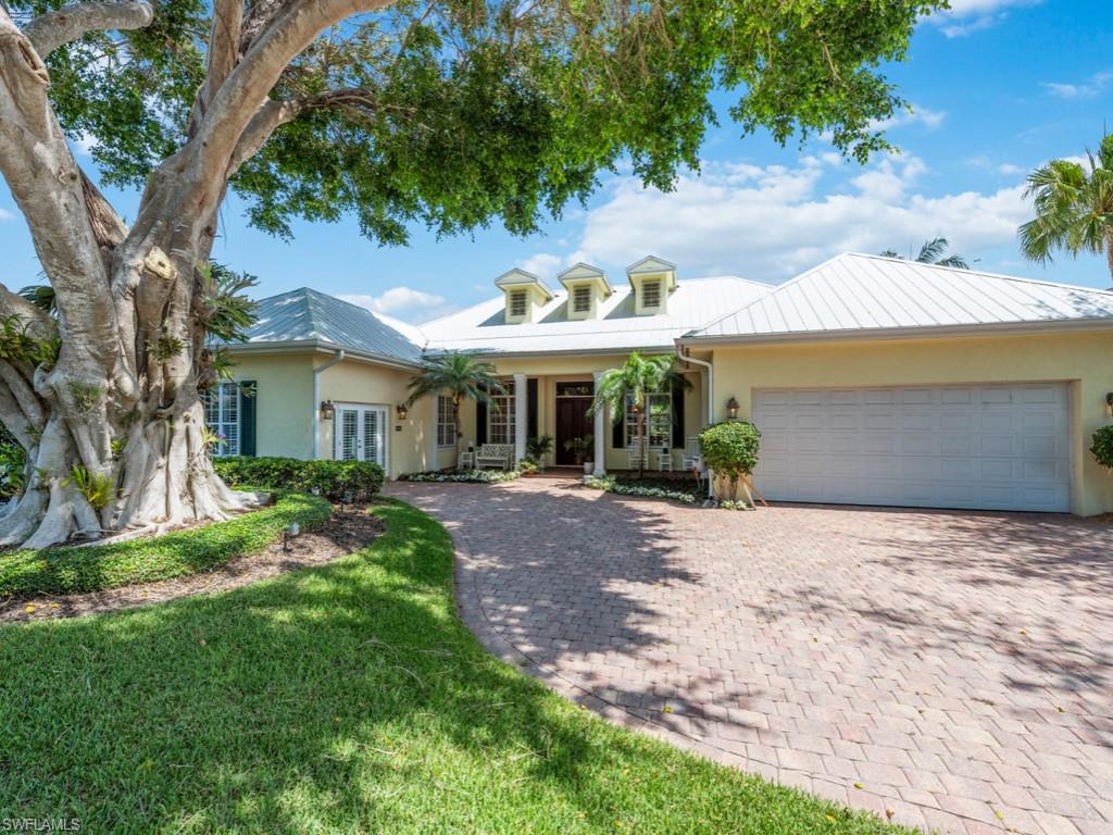505 Harbour Drive Naples, FL 34103 - Photo 37 of 37 a front view of a house with a yard and garage