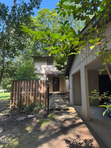 a house with a tree in front of it
