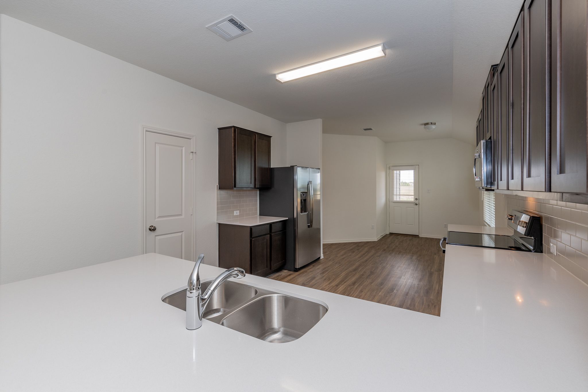 509 Greatest Gift Way Jarrell, TX 76537 - Photo 6 of 28 a kitchen with stainless steel appliances granite countertop a sink stove and refrigerator