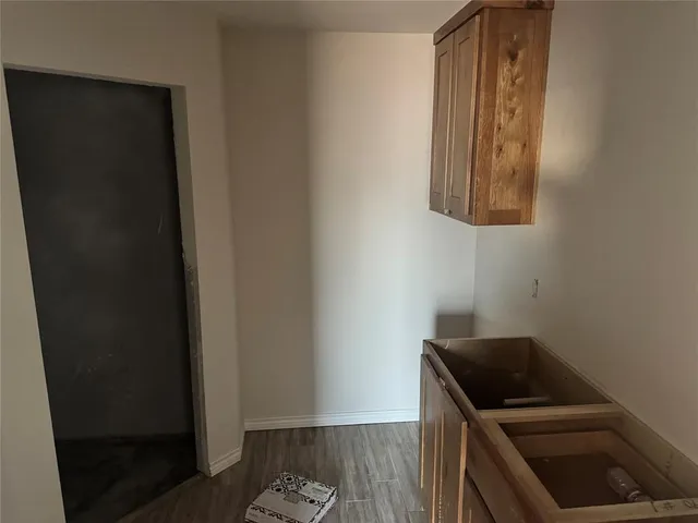 a kitchen with a refrigerator and a stove