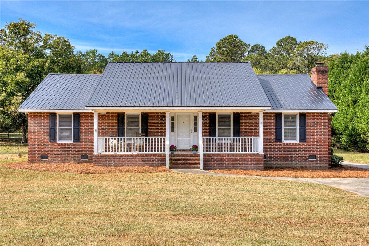 Updated brick ranch on 1.24 beautiful acres in Thomson with workshop/potential guest house!
