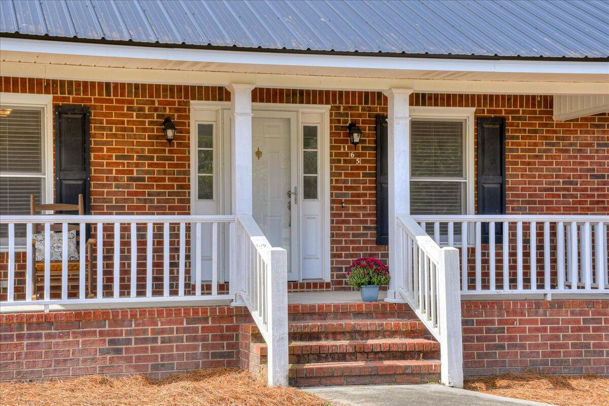 165 Morris Road Thomson, GA 30824 - Photo 2 of 26 Peaceful rocking chair porch!