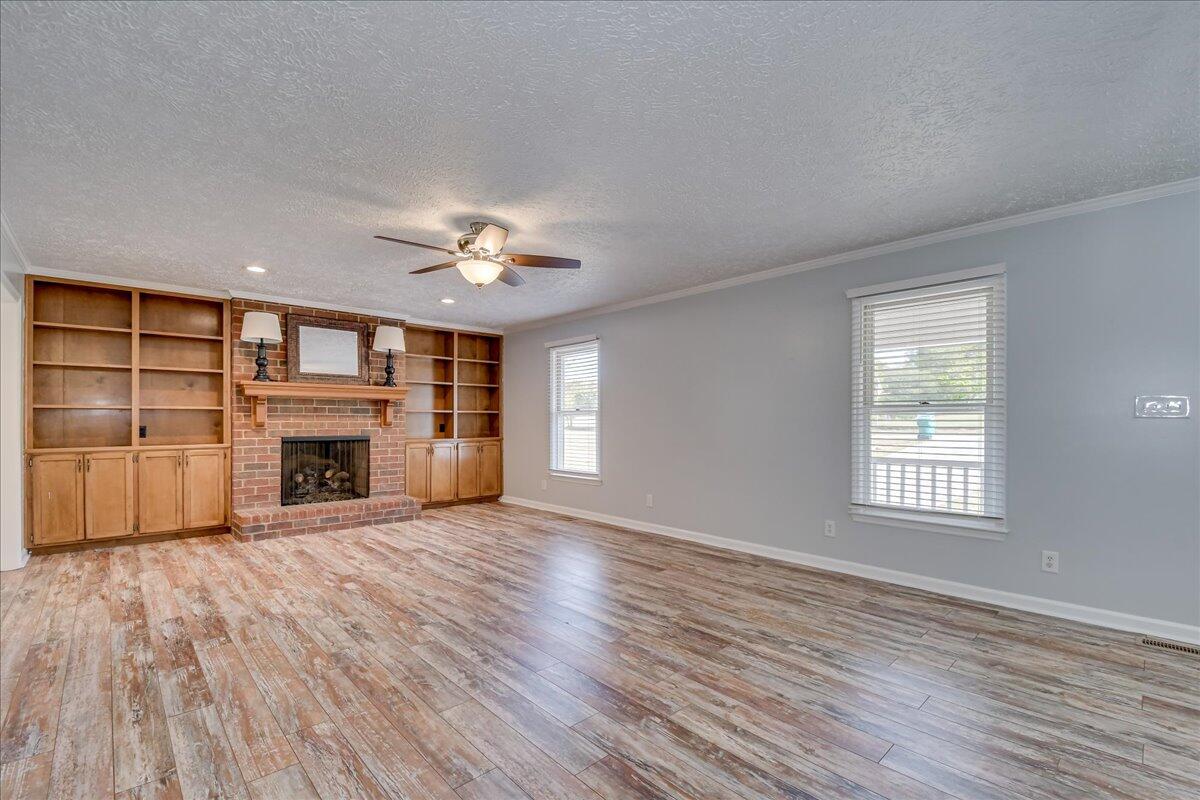 165 Morris Road Thomson, GA 30824 - Photo 7 of 26 LVP flooring in living room and bedrooms. No carpet anywhere in the house!