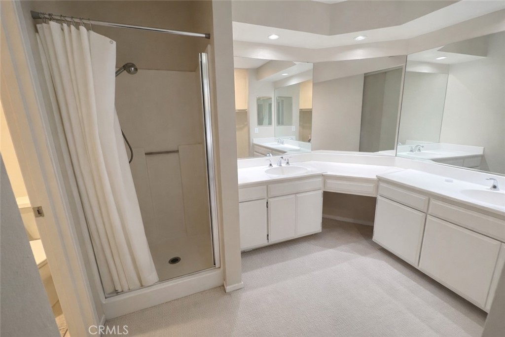 9275 Rancho Park Place Rancho Cucamonga, CA 91730 - Photo 17 of 33 Primary Bathroom. Image has been altered and does not portray the property as it exists today. Certain elements may have been deleted, color, brightness and contrast have been edited.