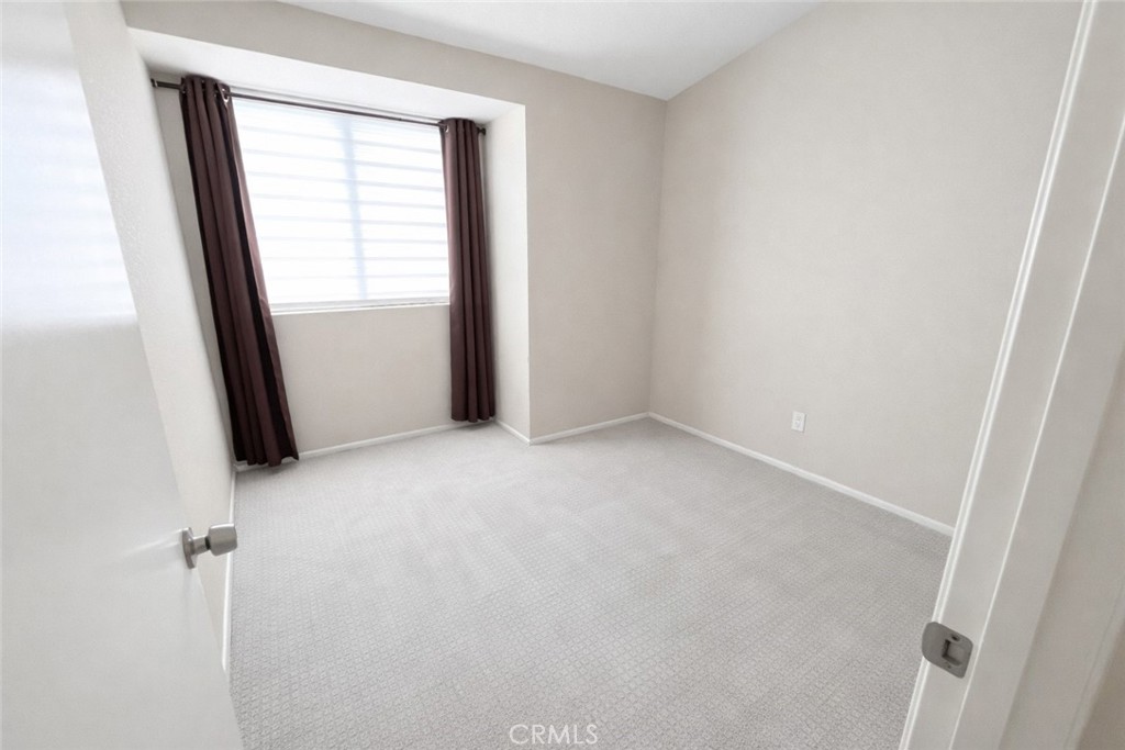 9275 Rancho Park Place Rancho Cucamonga, CA 91730 - Photo 25 of 33 Third Bedroom. Image has been altered and does not portray the property as it exists today. Certain elements may have been deleted, color, brightness and contrast have been edited.
