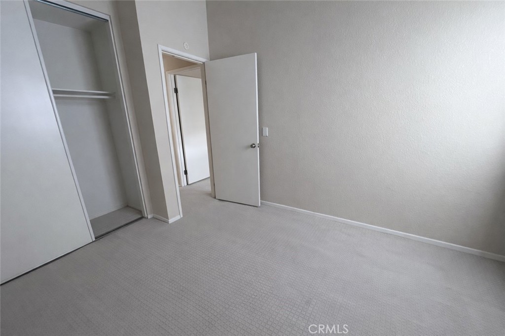 9275 Rancho Park Place Rancho Cucamonga, CA 91730 - Photo 26 of 33 Third Bedroom. Image has been altered and does not portray the property as it exists today. Certain elements may have been deleted, color, brightness and contrast have been edited.