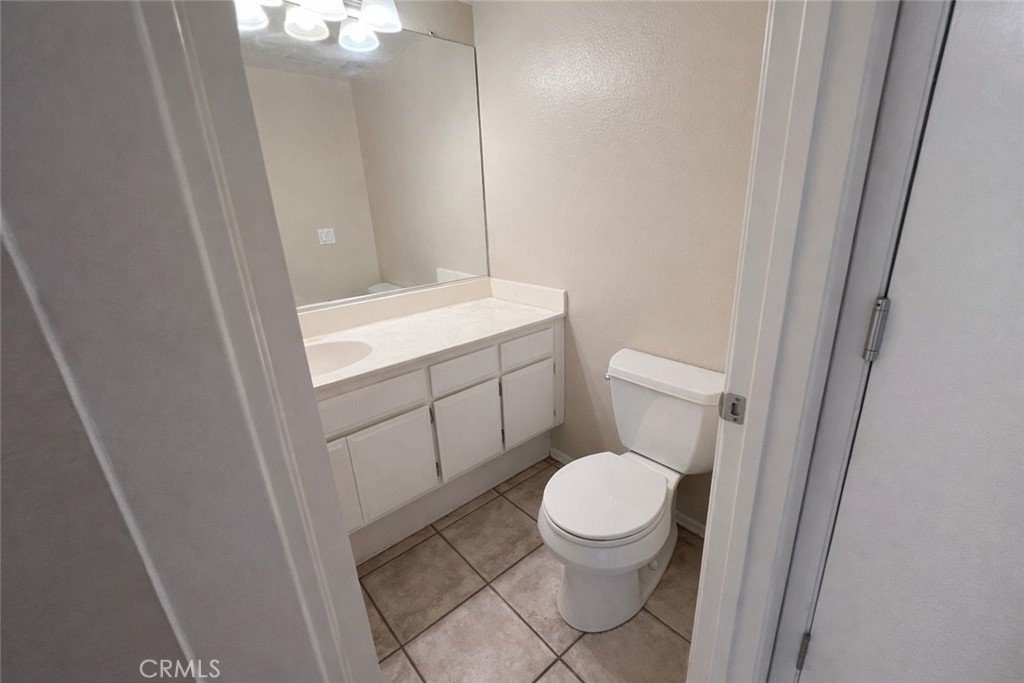 9275 Rancho Park Place Rancho Cucamonga, CA 91730 - Photo 9 of 33 Downstairs Restroom. Image has been altered and does not portray the property as it exists today. Certain elements may have been deleted, color, brightness and contrast have been edited.