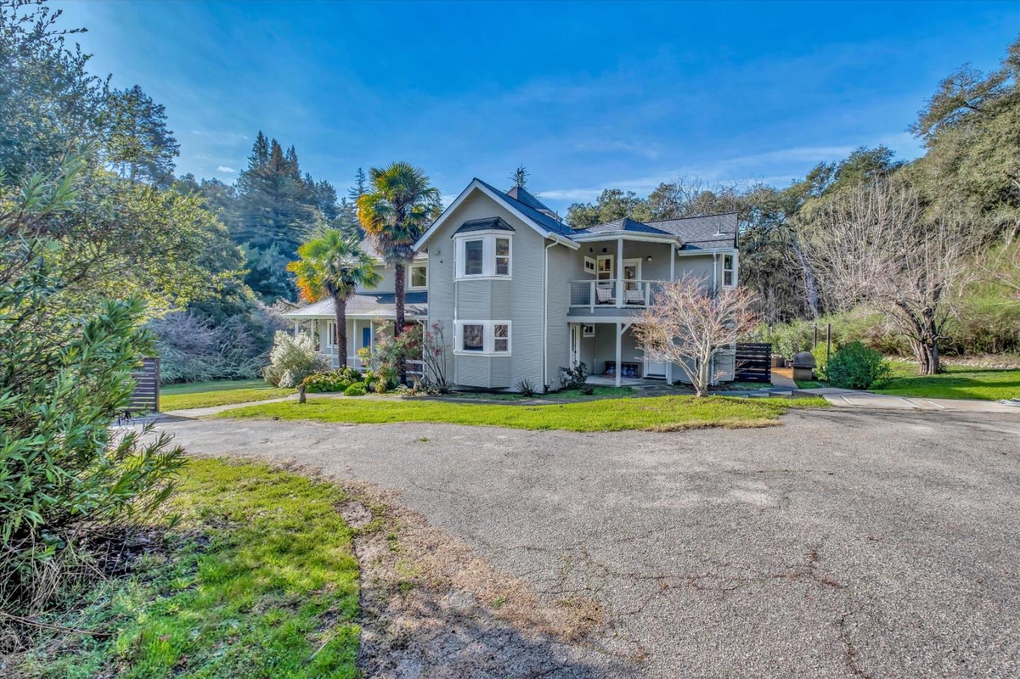 1573 North Rodeo Gulch Road Soquel, CA 95073 - Photo 1 of 40 a view of a house with a yard and large trees