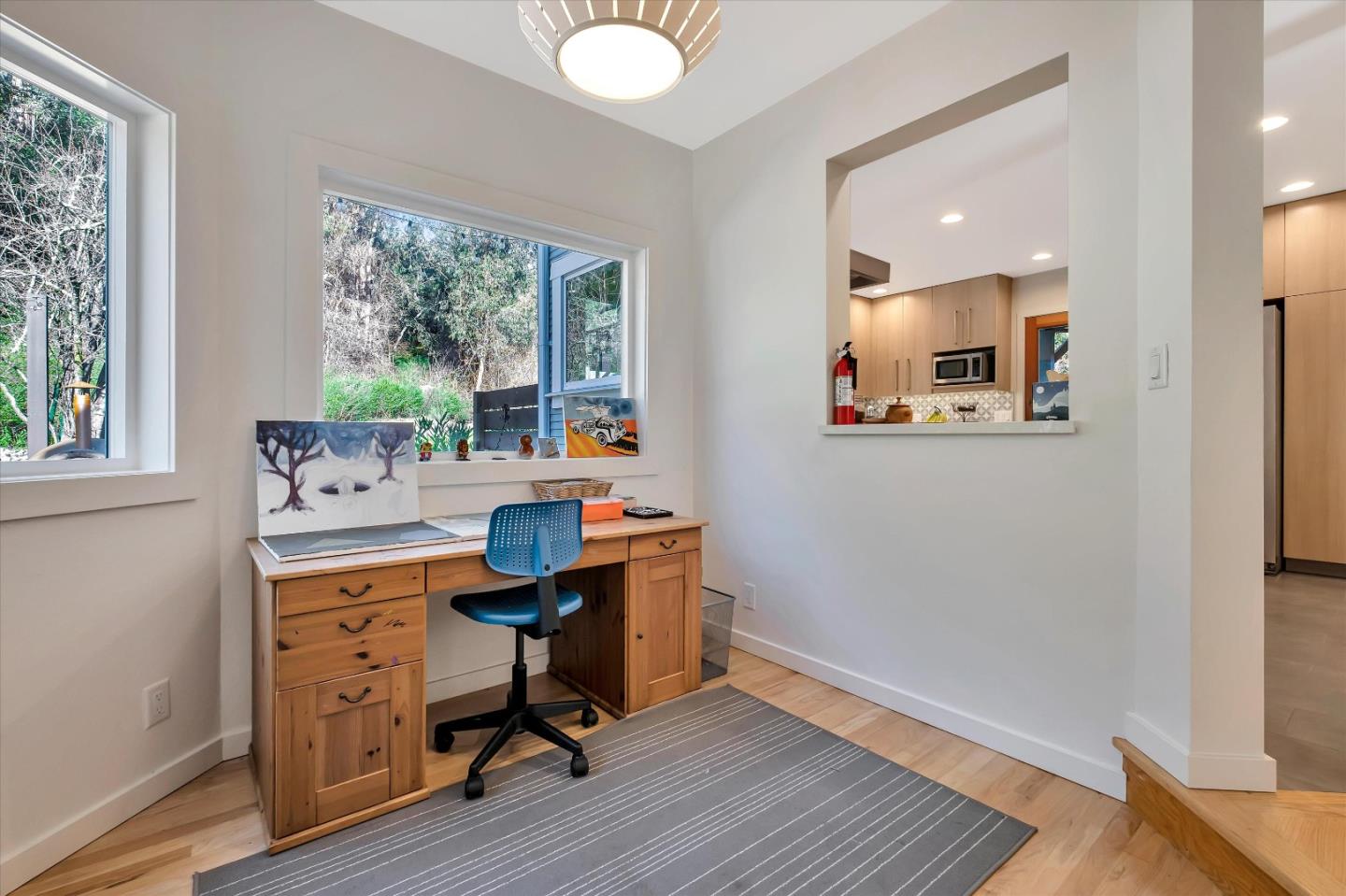1573 North Rodeo Gulch Road Soquel, CA 95073 - Photo 13 of 40 a view of a workspace with furniture and a window
