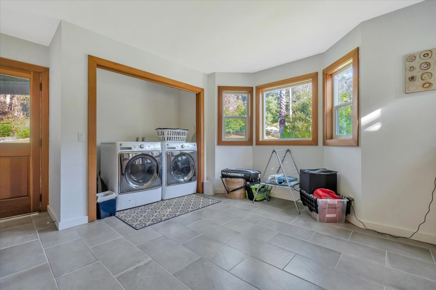 1573 North Rodeo Gulch Road Soquel, CA 95073 - Photo 16 of 40 a living room filled with furniture and a chandelier