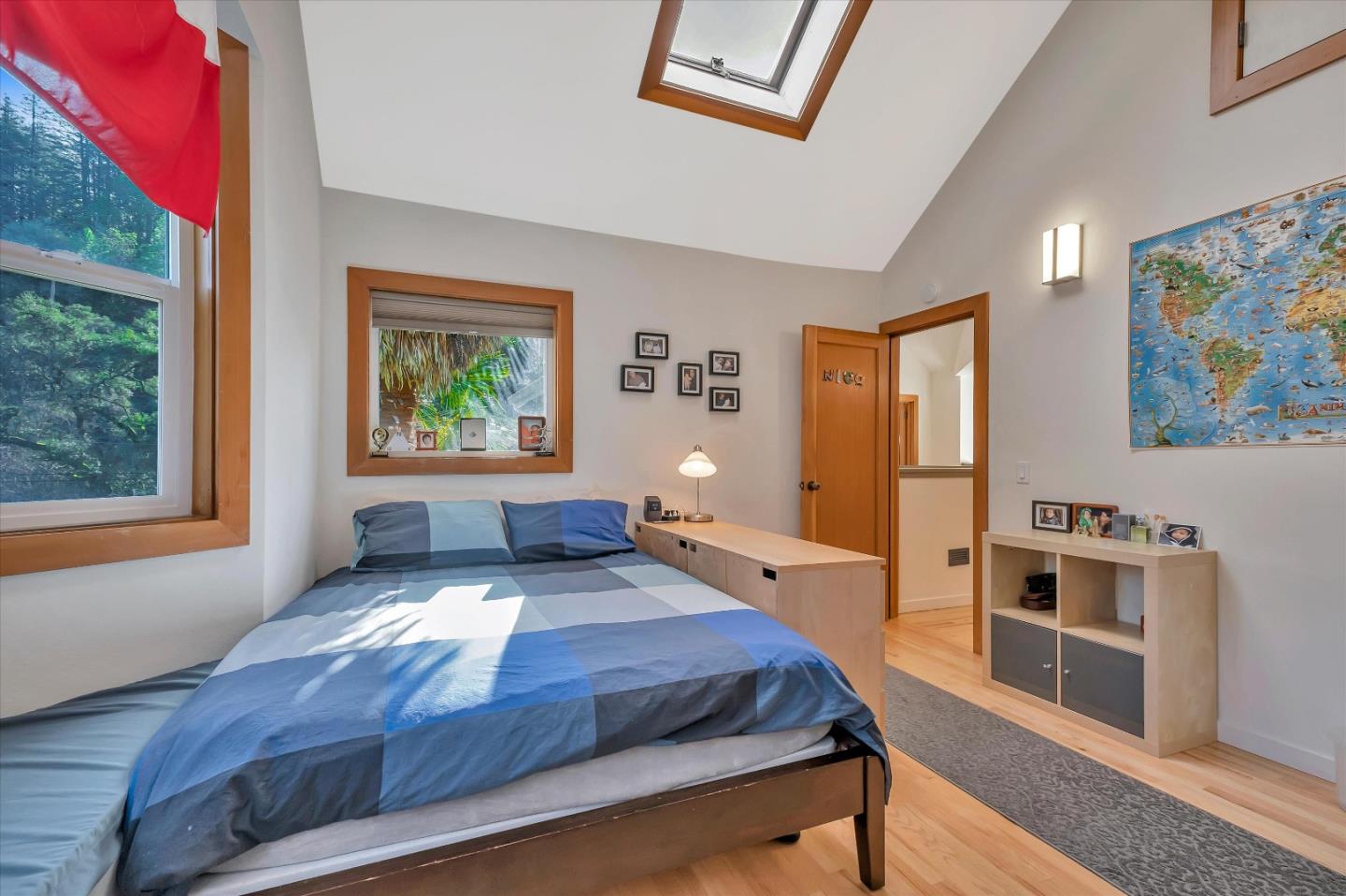 1573 North Rodeo Gulch Road Soquel, CA 95073 - Photo 23 of 40 a bedroom with a large bed and a window