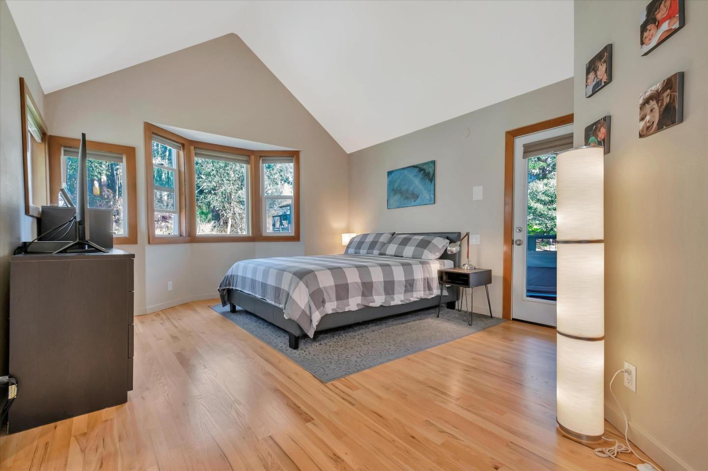 1573 North Rodeo Gulch Road Soquel, CA 95073 - Photo 25 of 40 a bedroom with a bed and large window