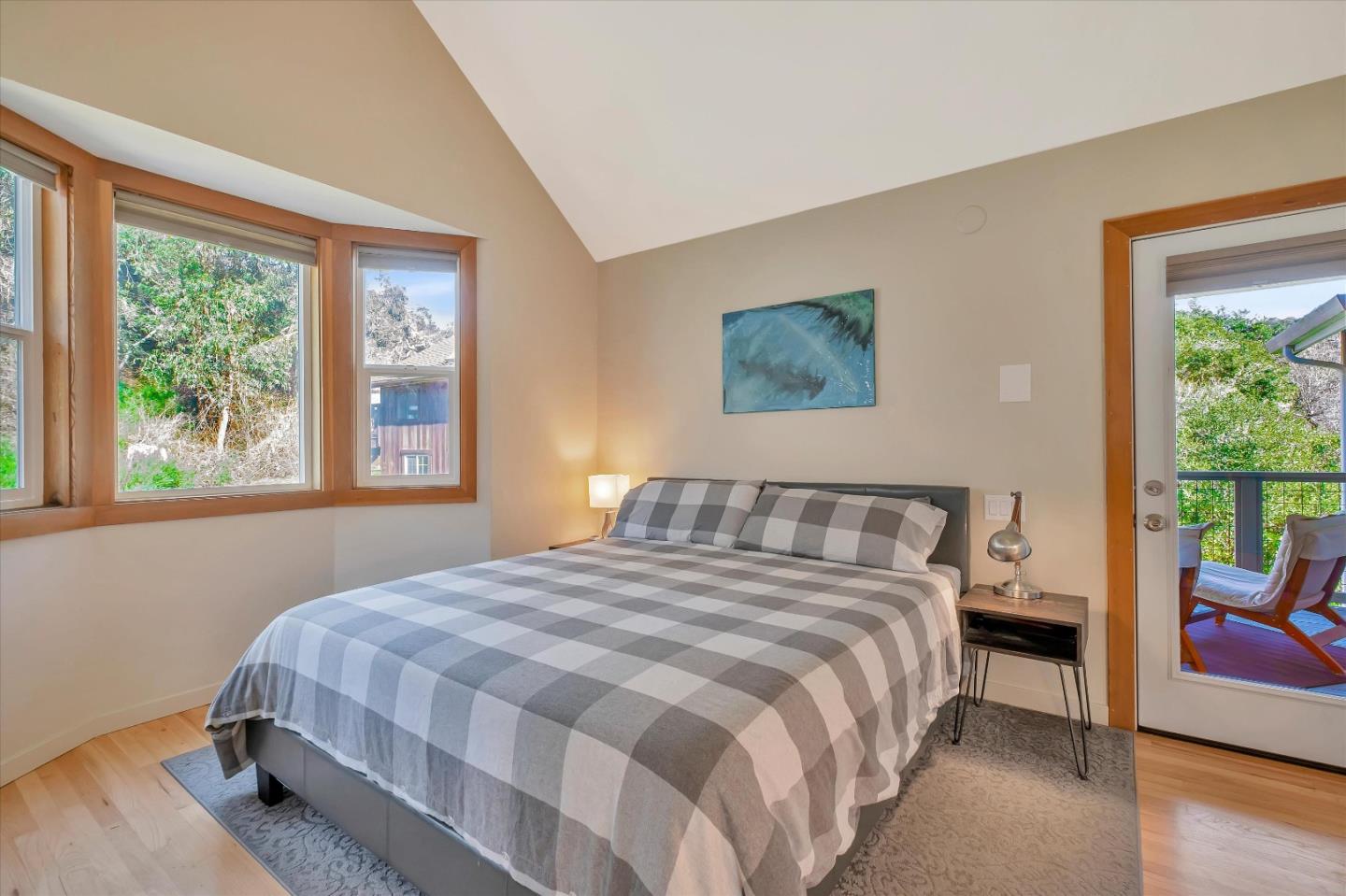 1573 North Rodeo Gulch Road Soquel, CA 95073 - Photo 26 of 40 a bedroom with a bed a couch and a window