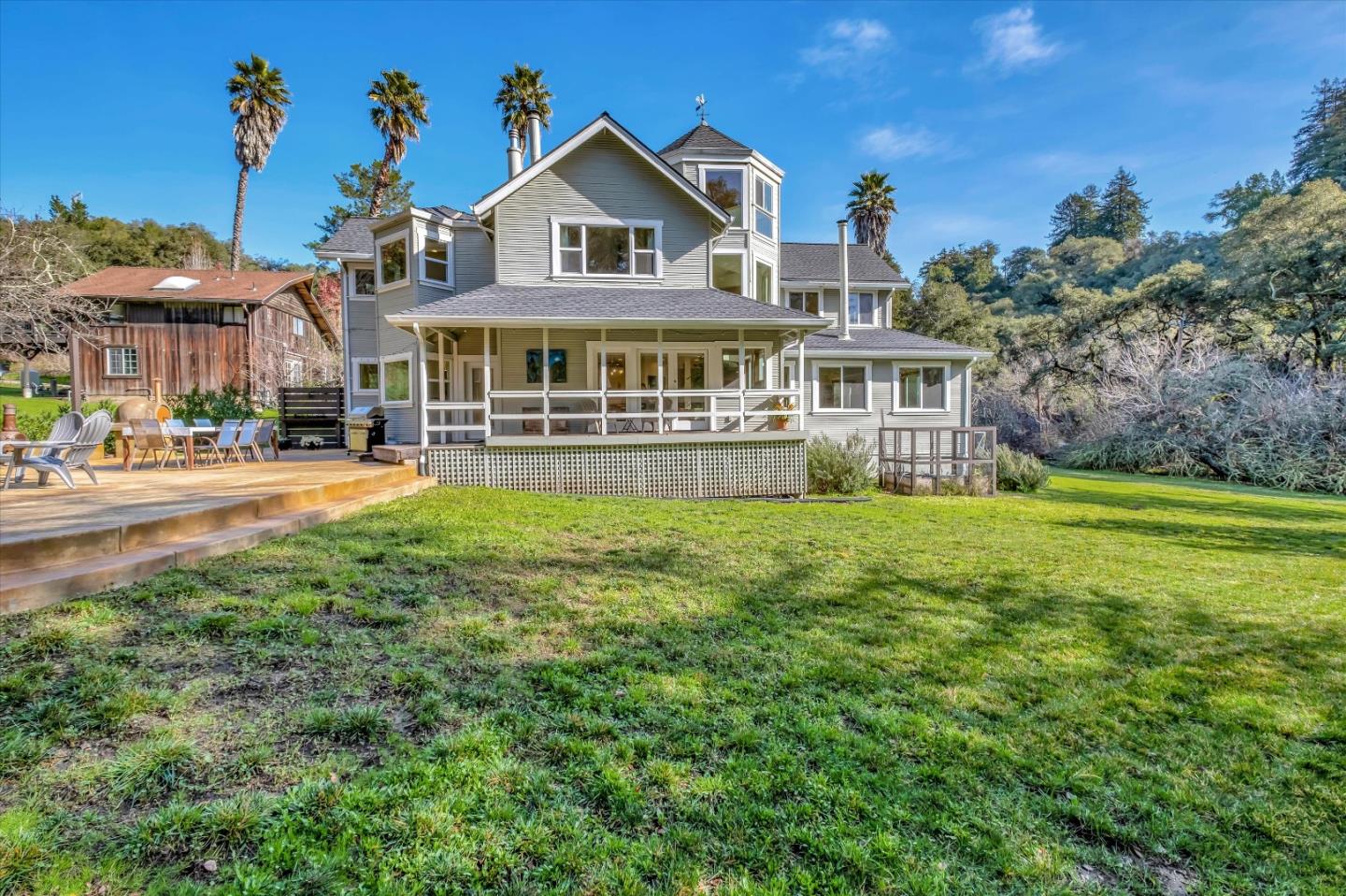 1573 North Rodeo Gulch Road Soquel, CA 95073 - Photo 32 of 40 a front view of a house with a yard table and chairs