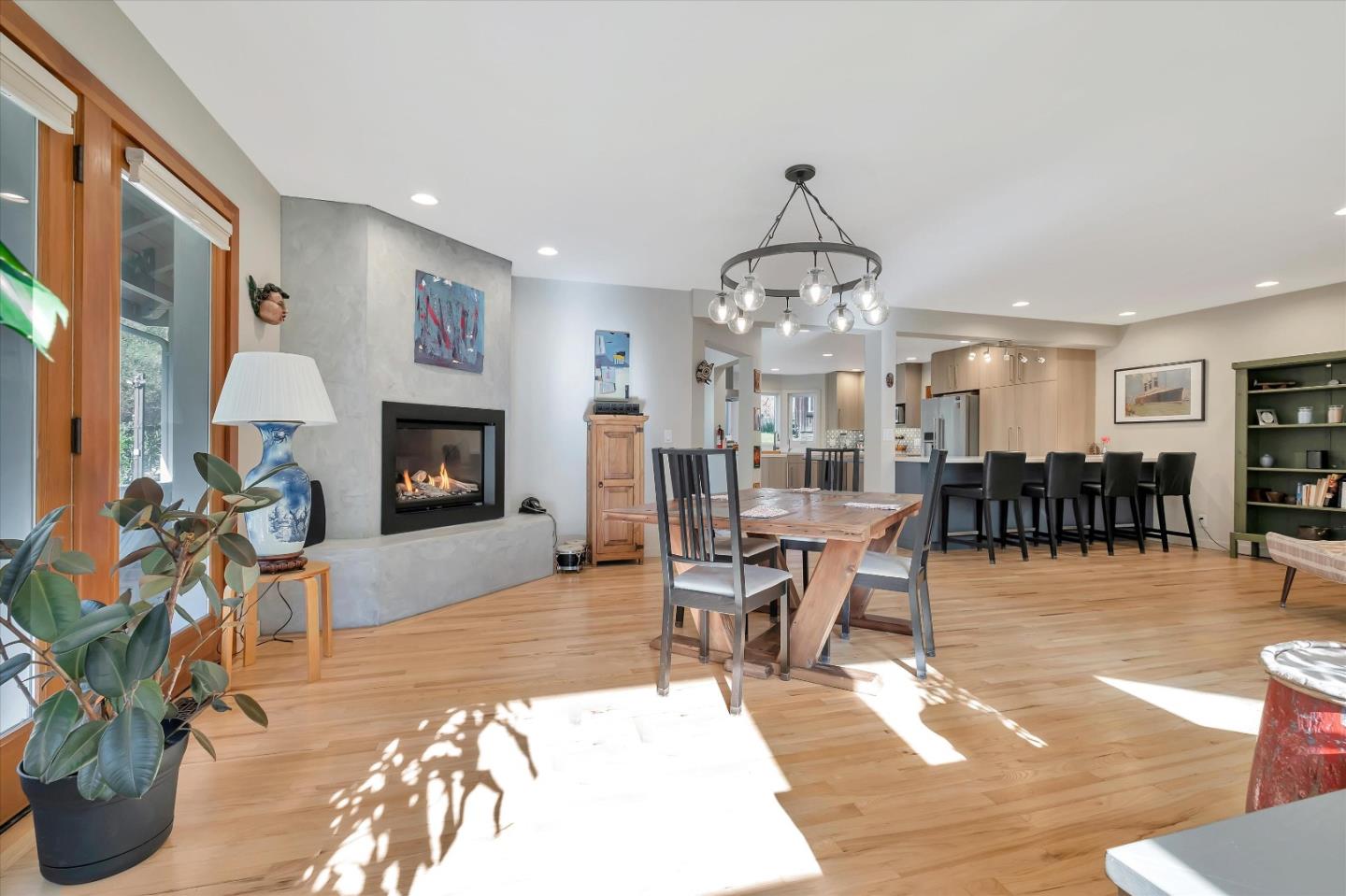 1573 North Rodeo Gulch Road Soquel, CA 95073 - Photo 7 of 40 a living room with furniture a fireplace and a chandelier