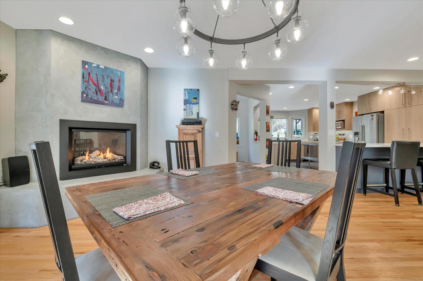 1573 North Rodeo Gulch Road Soquel, CA 95073 - Photo 8 of 40 a view of a dining room and a livingroom with furniture wooden floor a chandelier
