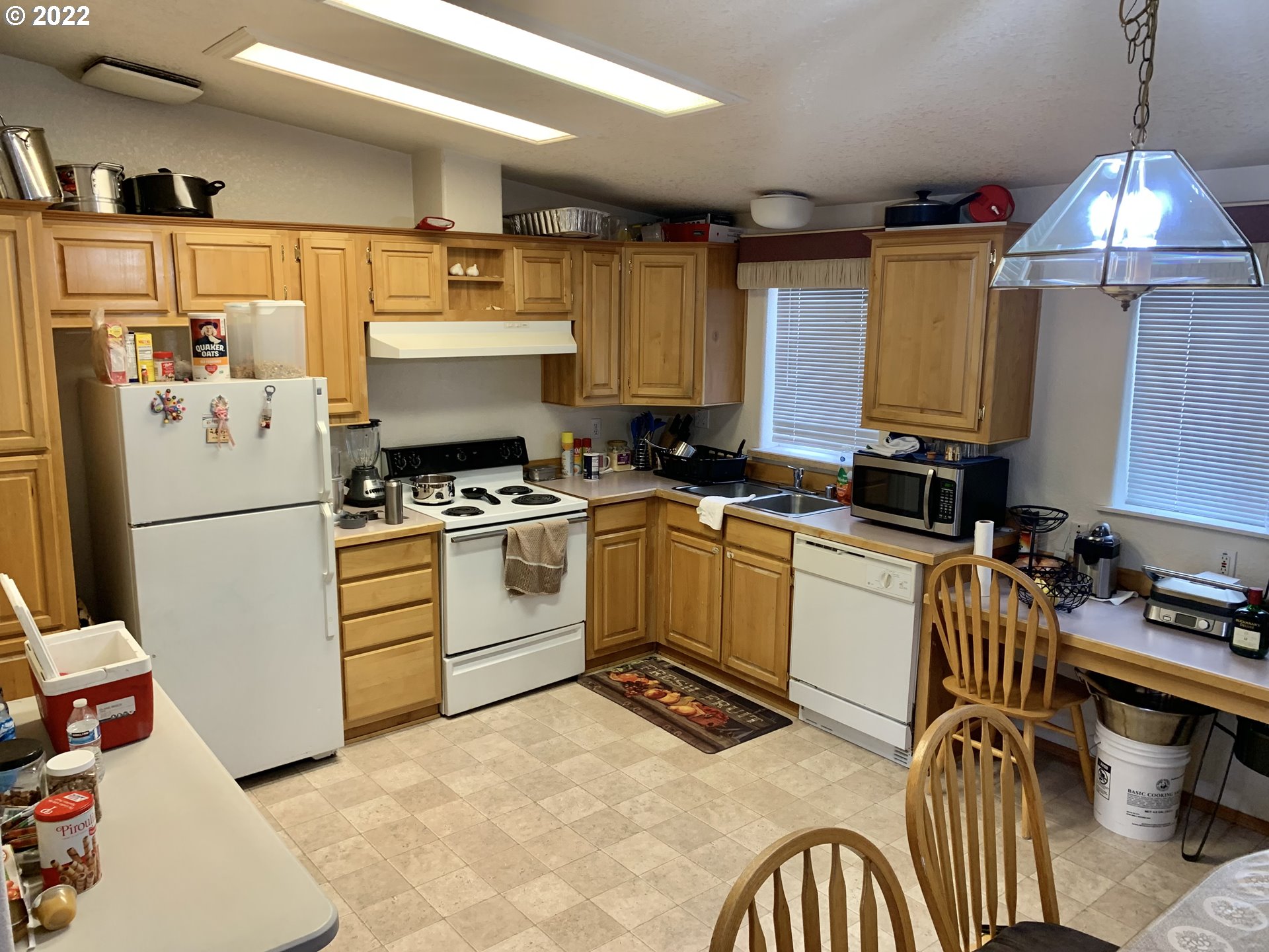 5510 E Street Springfield, OR 97478 - Photo 2 of 6 a kitchen with a refrigerator and a stove top oven