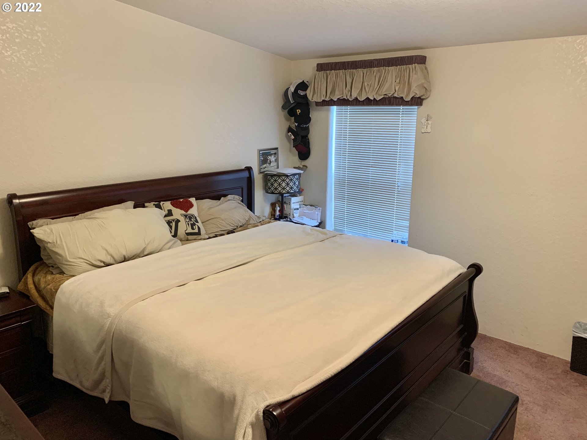 5510 E Street Springfield, OR 97478 - Photo 5 of 6 a large bed sitting in a bedroom next to a window