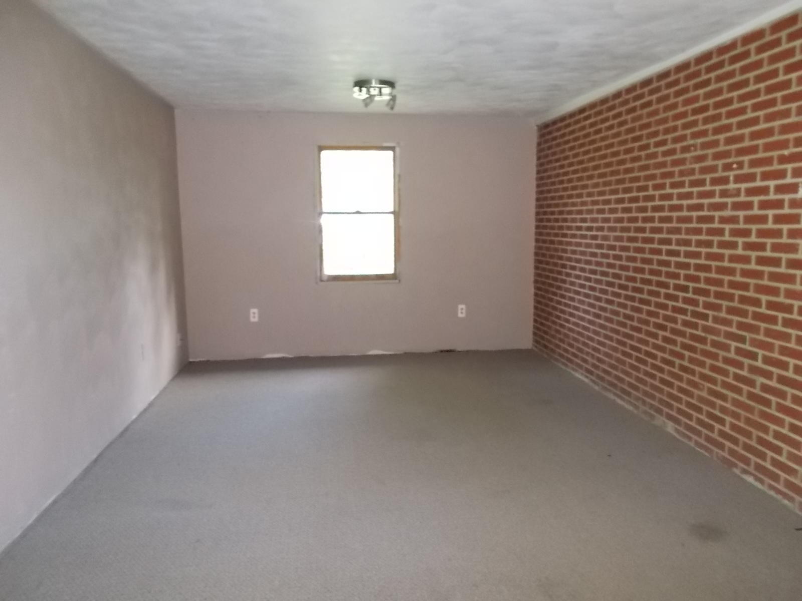 8974 Pine Forest Road Northeast Copper Hill, VA 24079 - Photo 15 of 21 a view of an empty room with a window