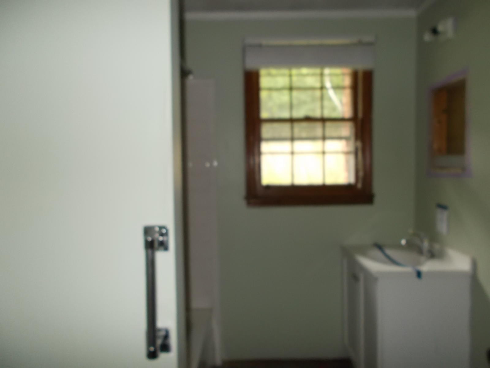 8974 Pine Forest Road Northeast Copper Hill, VA 24079 - Photo 18 of 21 a bathroom with a sink and mirror