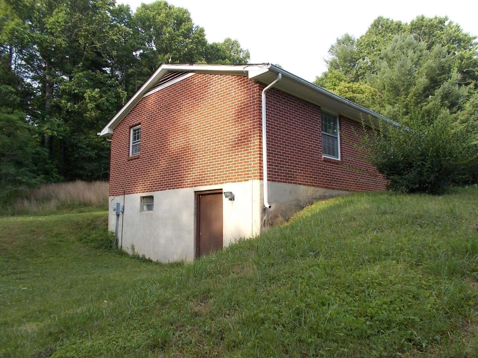 8974 Pine Forest Road Northeast Copper Hill, VA 24079 - Photo 4 of 21 a backyard of a house with lots of green space