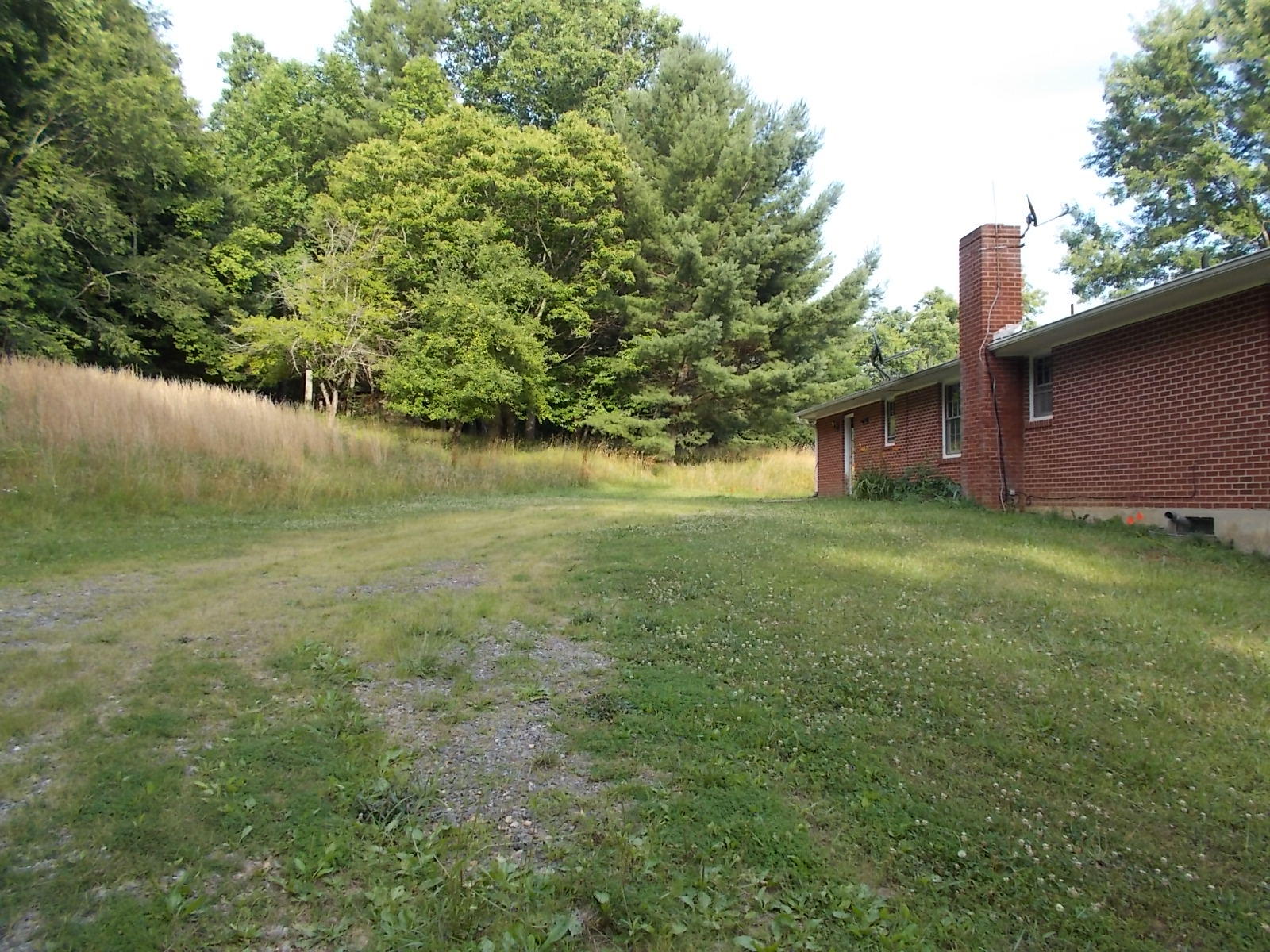 8974 Pine Forest Road Northeast Copper Hill, VA 24079 - Photo 6 of 21 a view of a back yard of the house