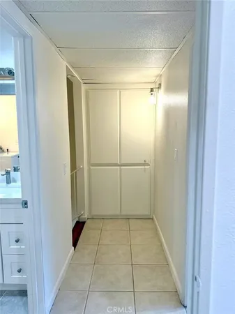 a bathroom with a shower and a glass door