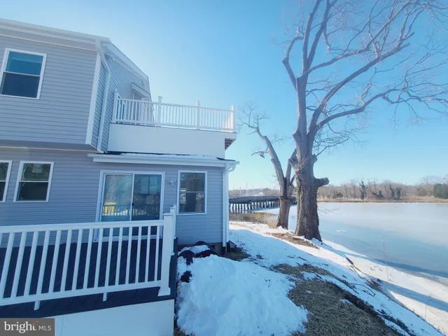 a view of a brick house with a yard