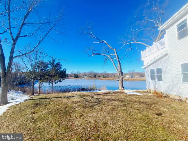 a view of pool with a yard