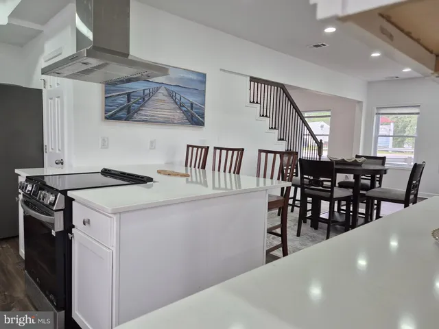 a view of dining room kitchen with furniture and window