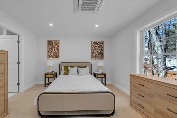 a bed room with a bed and a dresser