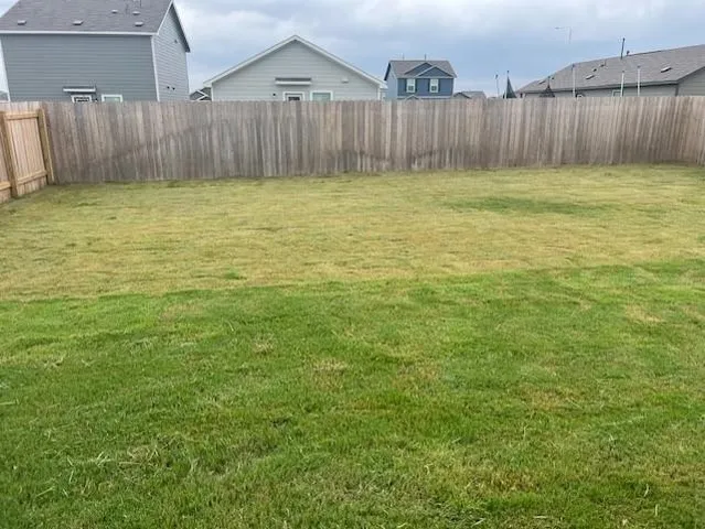 a view of a backyard of house