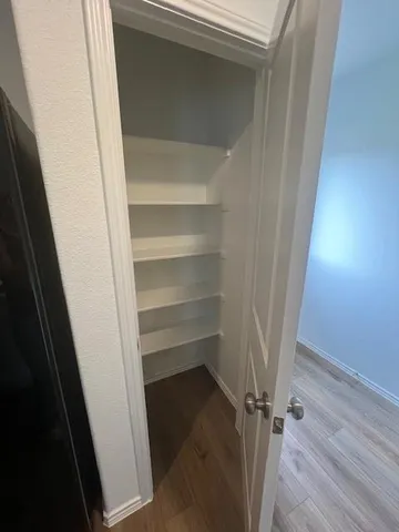 a stove top oven sitting inside of a kitchen