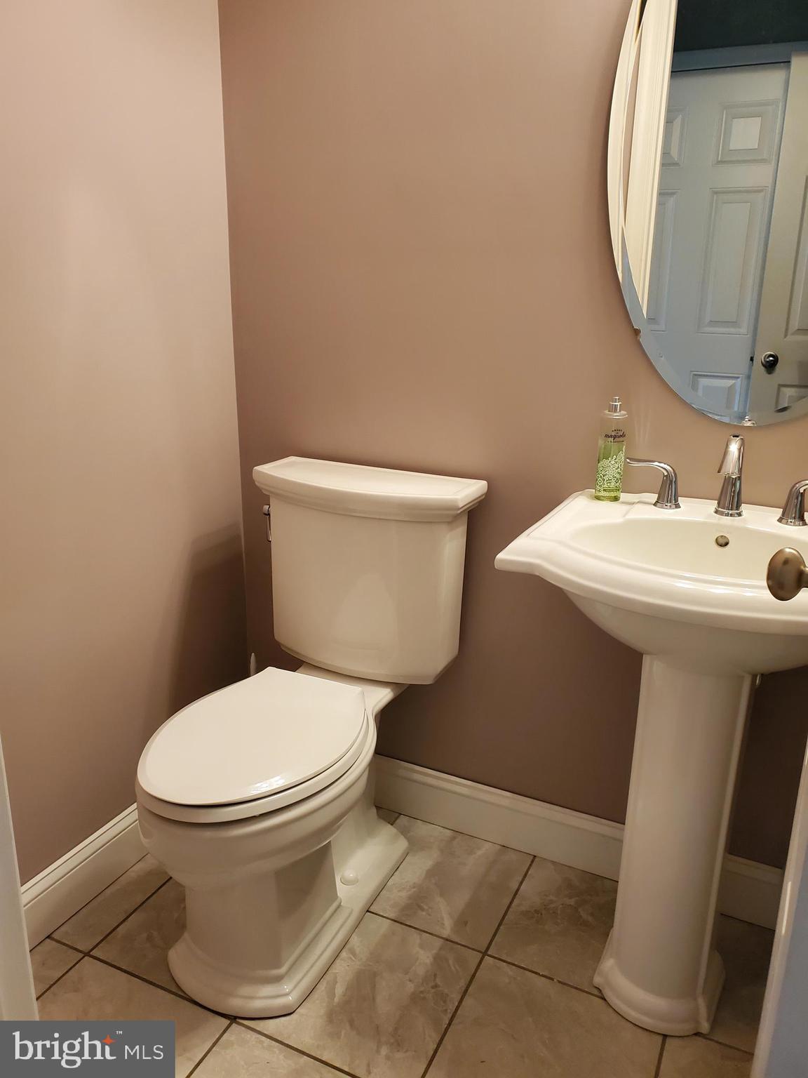 7520 Broomes Island Road St. Leonard, MD 20685 - Photo 14 of 35 Main level powder room with ceramic tile