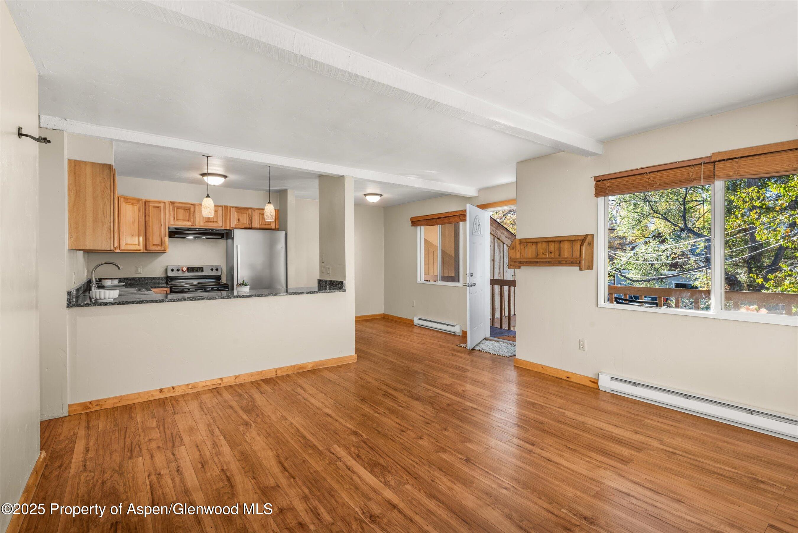 718 Main Street Carbondale, CO 81623 - Photo 4 of 27 a view of a kitchen with wooden floor and electronic appliances
