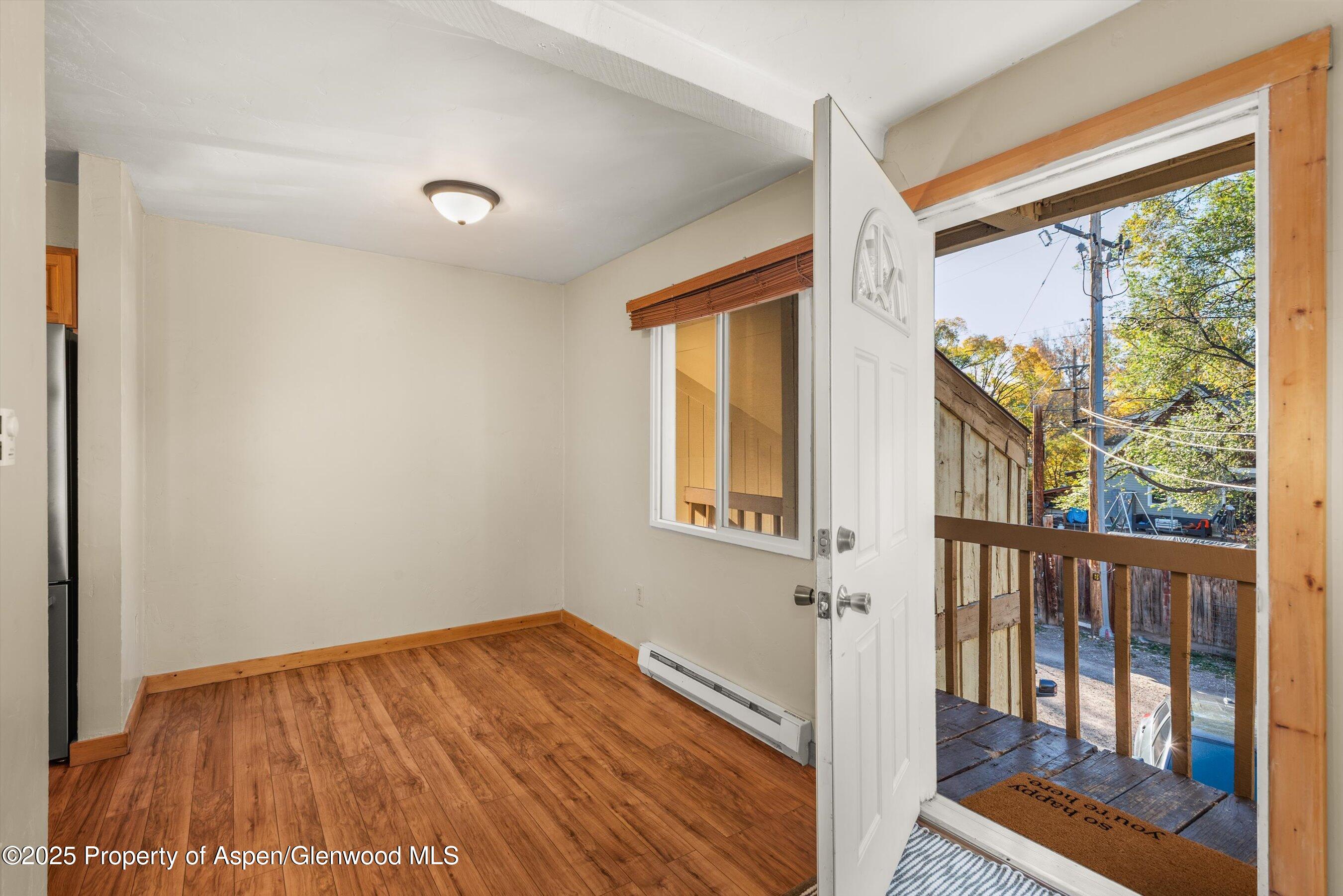 718 Main Street Carbondale, CO 81623 - Photo 8 of 27 a view of empty room with wooden floor and fan