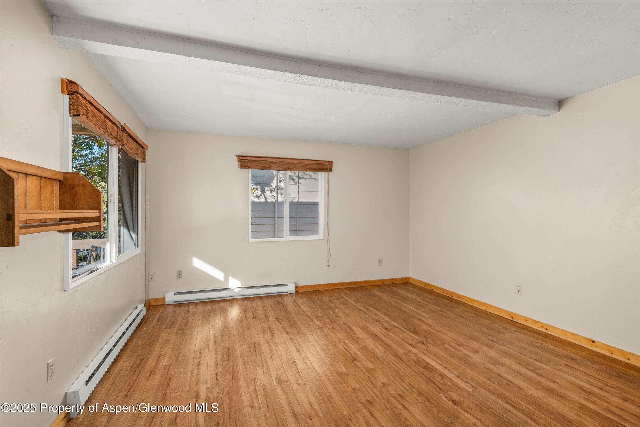 718 Main Street Carbondale, CO 81623 - Photo 10 of 27 wooden floor in an empty room with a window