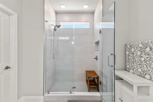 a front view of a house with a garden and plants