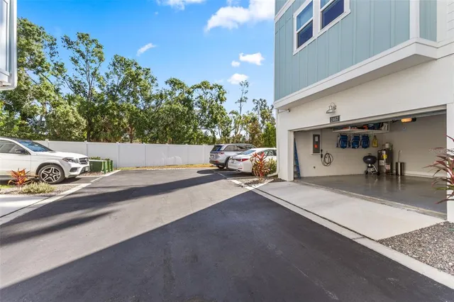 a front view of a house with a tree