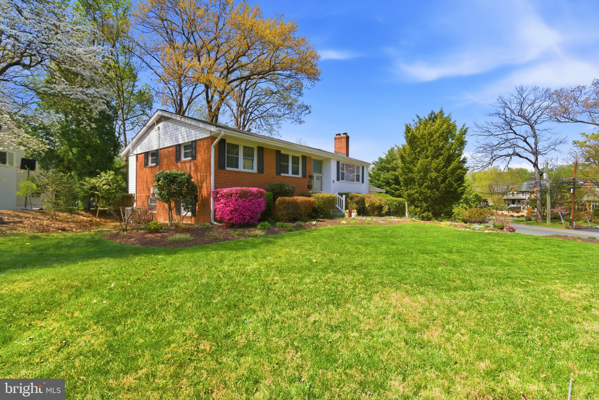 6535 Old Chesterbrook Road McLean, VA 22101 - Photo 2 of 50 a front view of a house with garden
