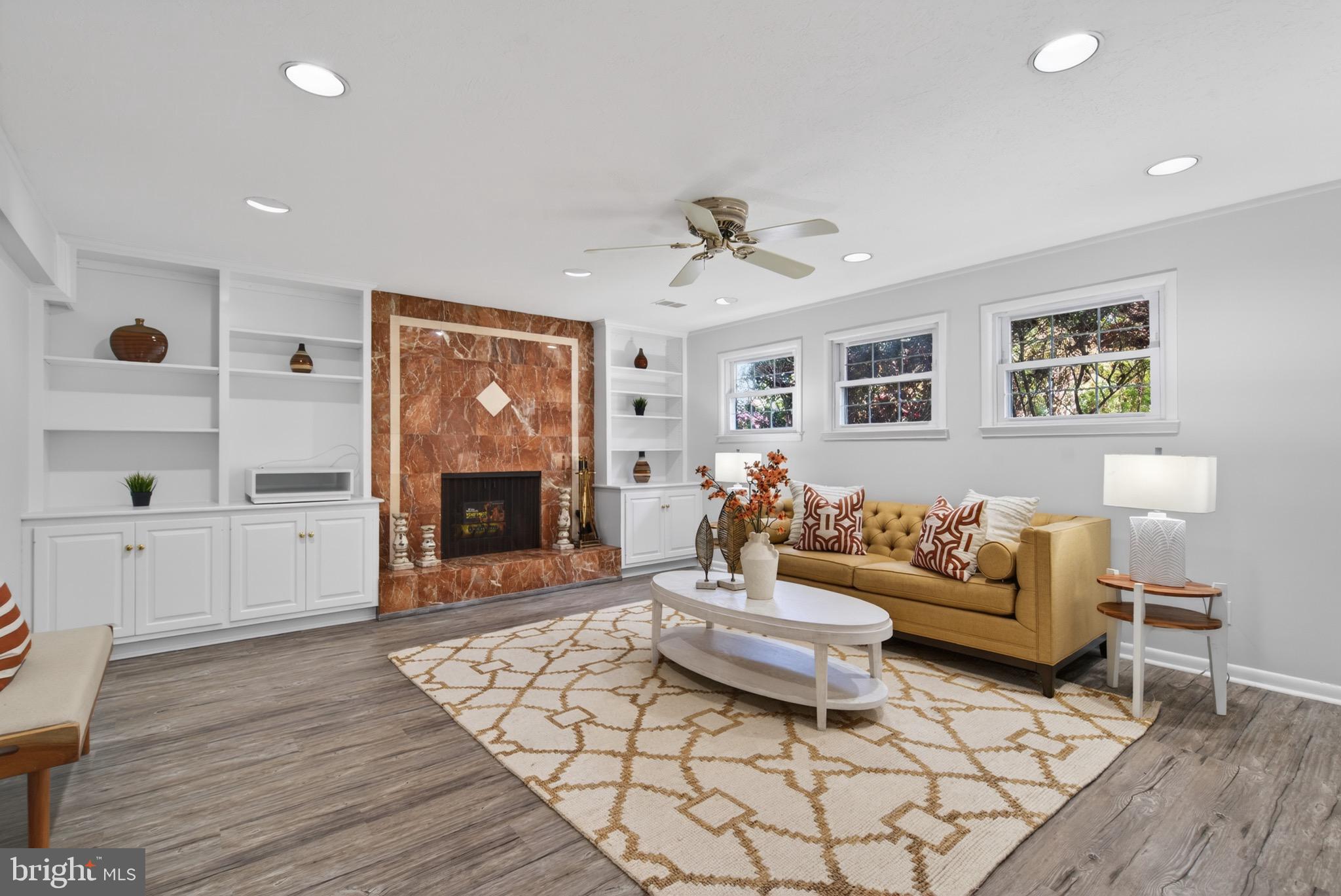 6535 Old Chesterbrook Road McLean, VA 22101 - Photo 36 of 50 a living room with furniture and a fireplace
