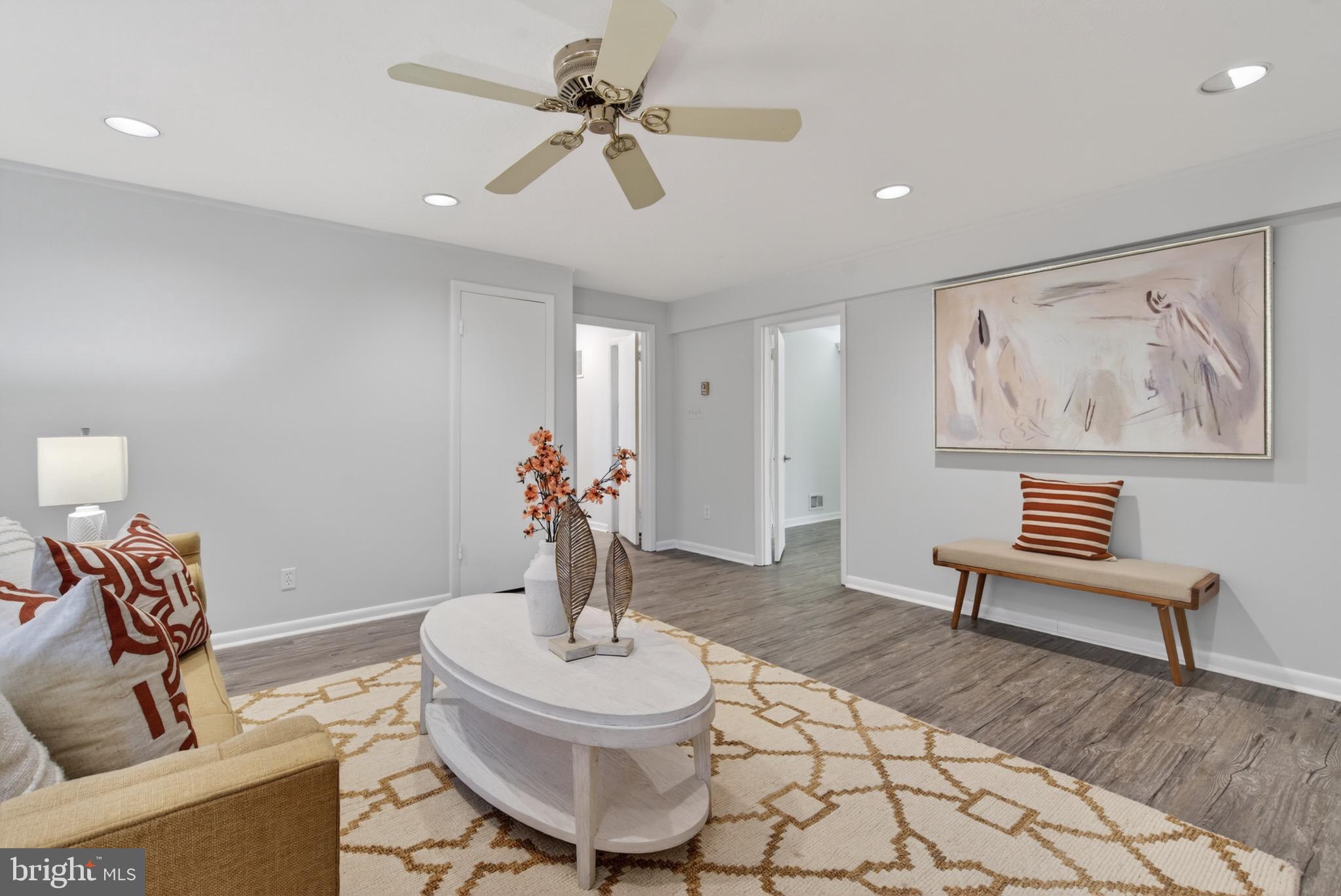 6535 Old Chesterbrook Road McLean, VA 22101 - Photo 39 of 50 a living room with furniture and a chandelier