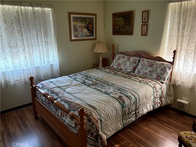 a large bed sitting in a bedroom next to a small yard