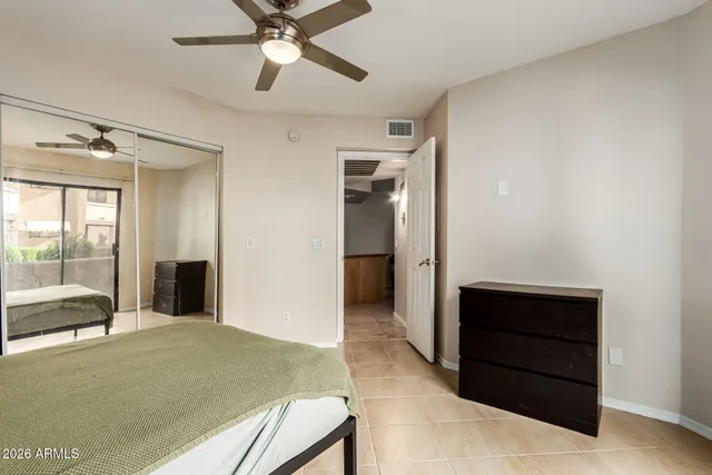 a bedroom with a bed and a dresser