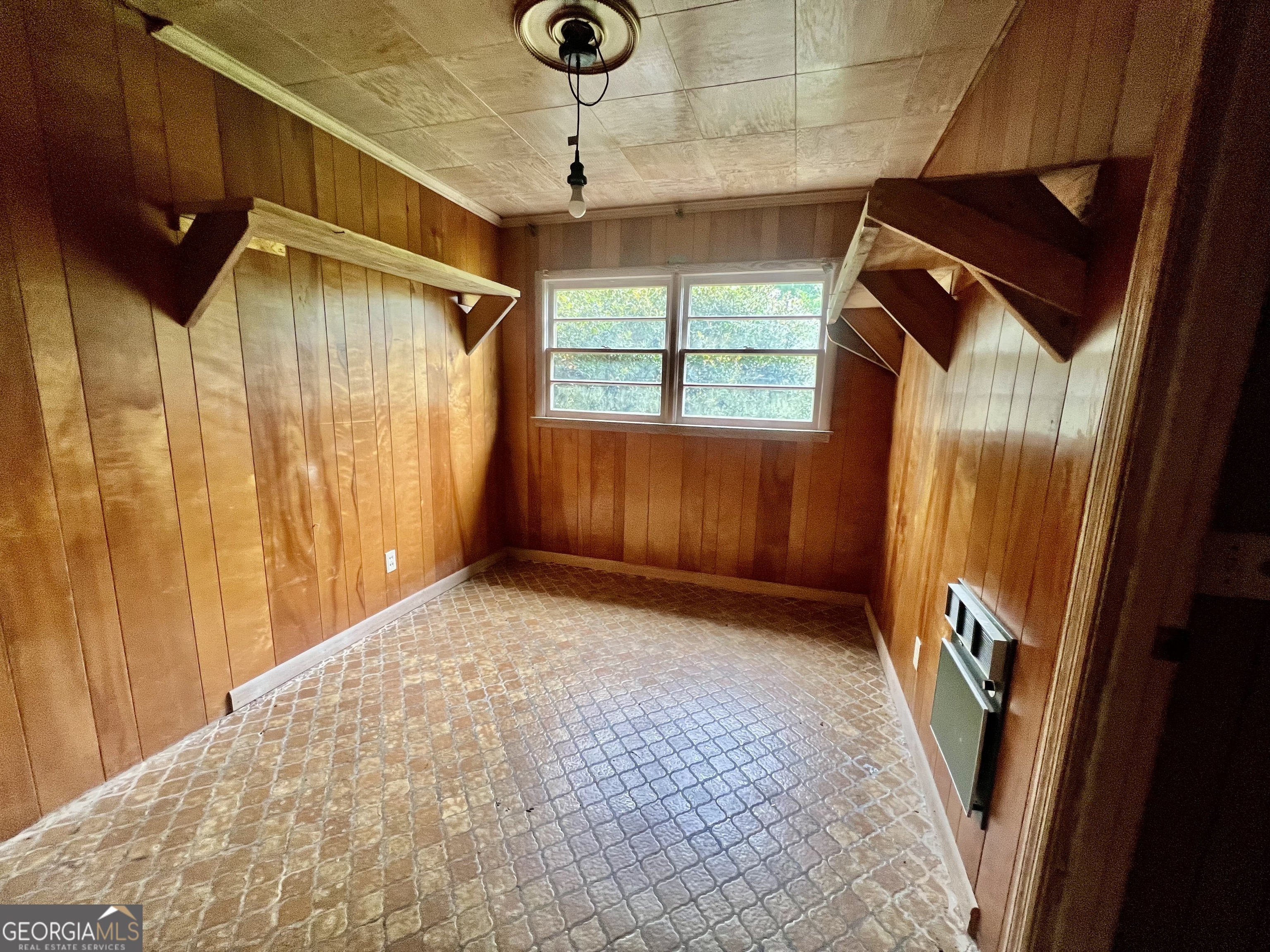 1165 Jaybird Springs Road Chauncey, GA 31011 - Photo 18 of 43 a view of an empty room with a window